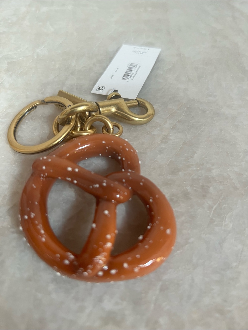 COACH Gold Clip Pretzel Bag Charm